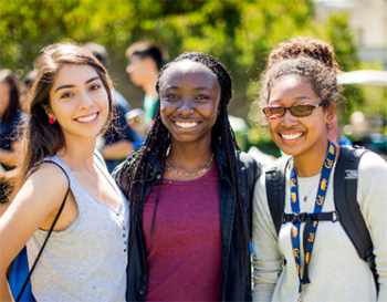 Three students smiling